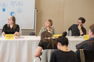 Jen Vaughn, Allison Baker, and Bill Kartalopoulos listening attentively on the panel.