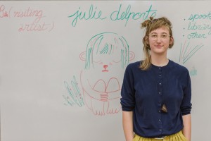 Julie Delporte with her name board, drawn by Luke Howard.