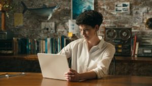 Katherine Roy working on a Windows 10 laptop